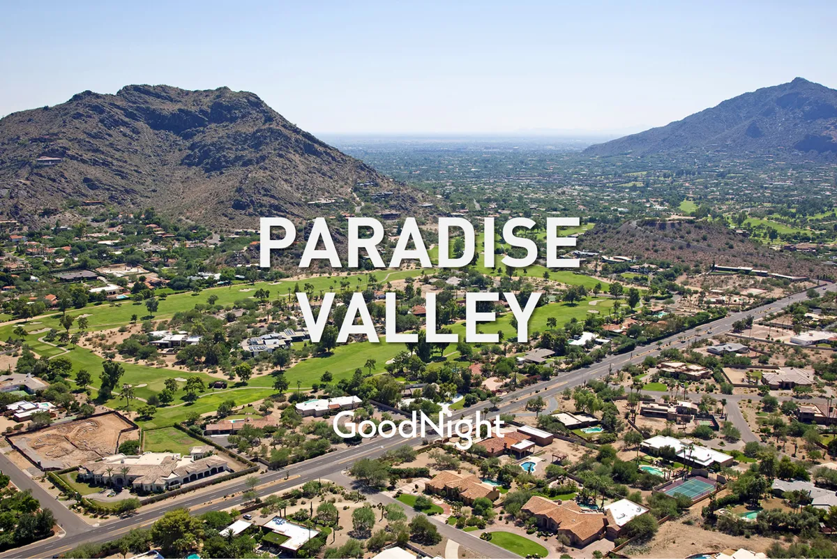 A wide-angle view of Scottsdale’s scenic landscape, including mountains, lush greenery, and residential areas, evoking the region’s natural beauty and vibrant atmosphere. The image hints at the adventure and excitement awaiting just outside the property.